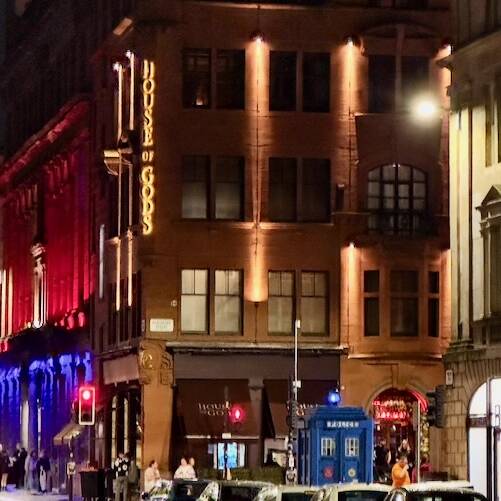 Image of bars and hotels on the corner of Glassford and Wilson Streets